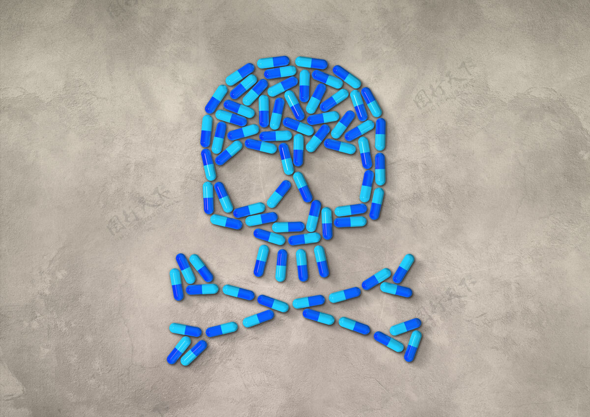 医学头骨由蓝色的胶囊药丸制成 隔离在混凝土背景上处方抗生素混凝土