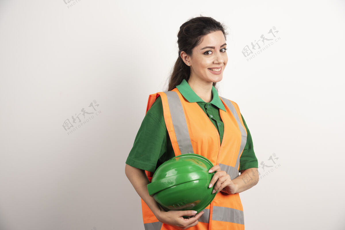工程成功的女人戴着安全帽穿着制服高质量的照片安全帽工人服装