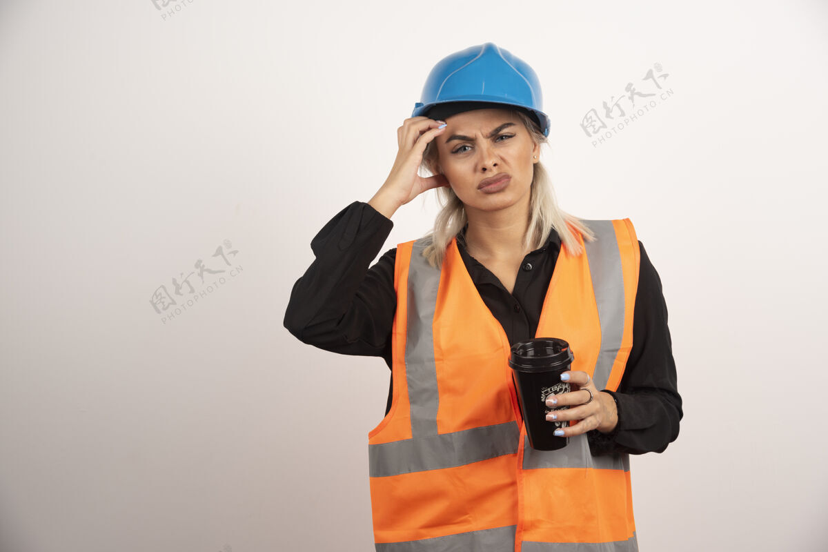 头盔建筑工人喝着一杯茶头痛高质量照片工程师成人人
