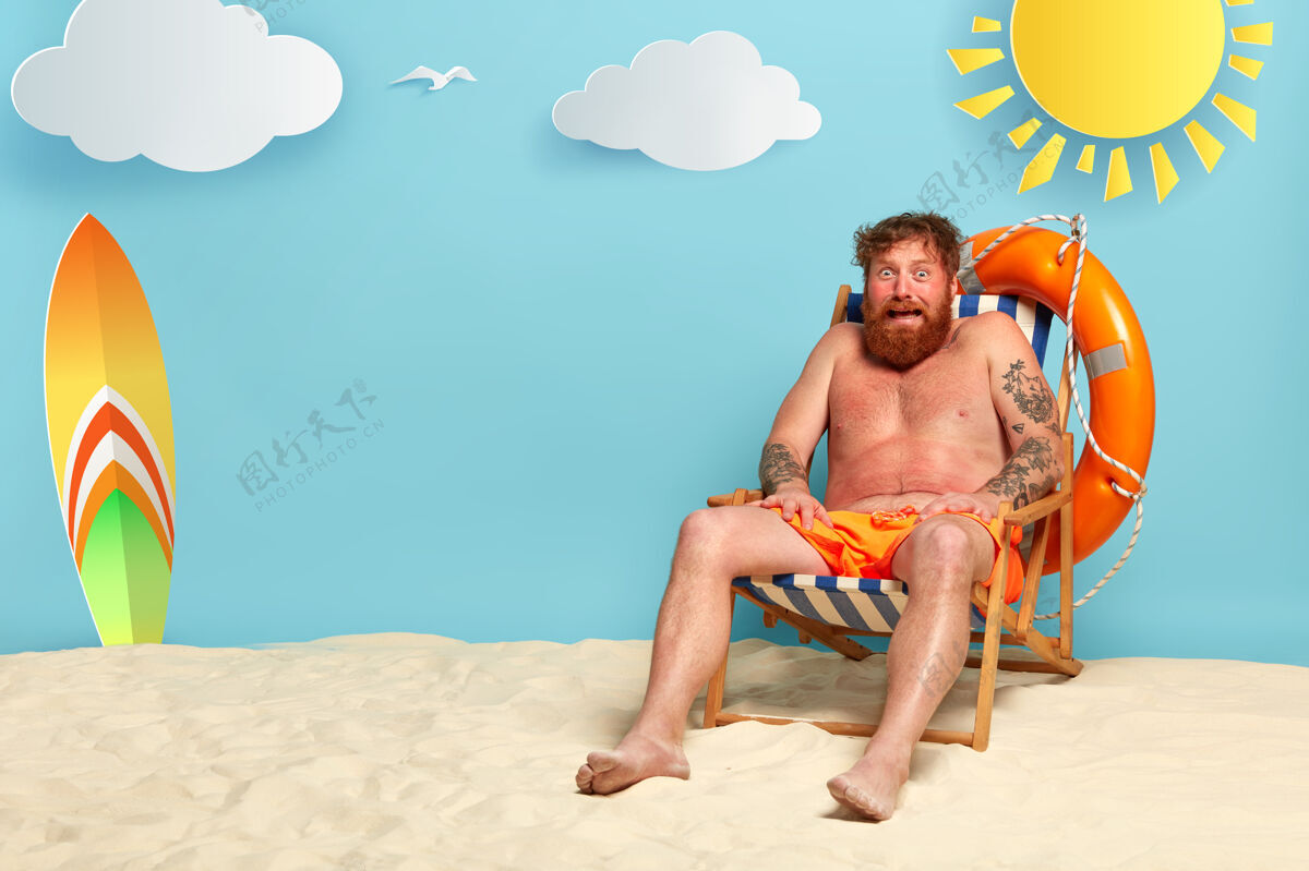 防晒霜受惊的红胡子男人在海滩上被晒伤了晒黑不健康云